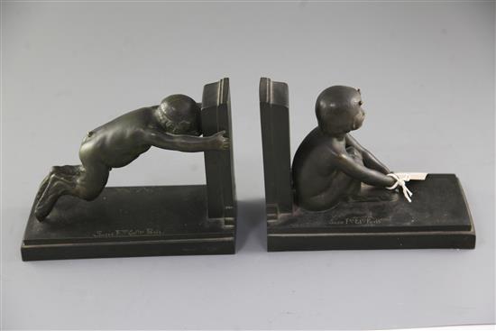 Paul Silvestre (French 1884-1976). A pair of early 20th century patinated bronze bookends, Susse Freres, Paris, length 8.25in.